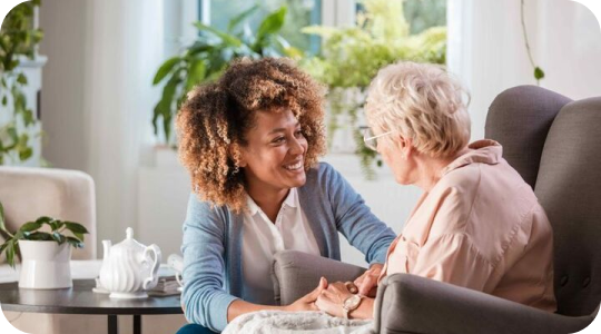 young black woman acts as a caregiver to older white woman with dementia